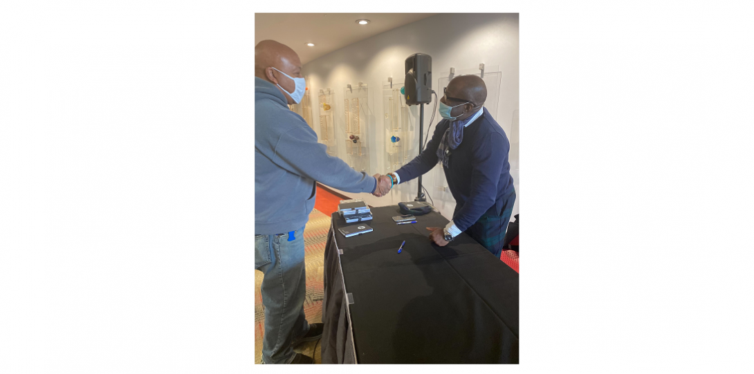 author shaking hands with guest